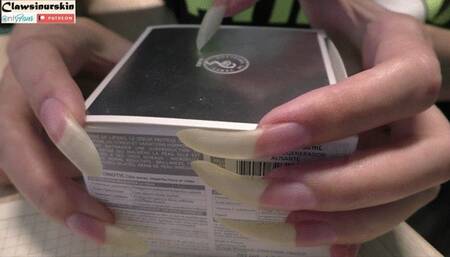 Scratching the carton with long nails