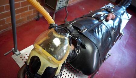 Bag of Tricks - Ruckus and Elise Graves - Sexy Ruckus is Bound in Rubber Rest Sack, Gas Mask and Completely at Elise's Mercy!