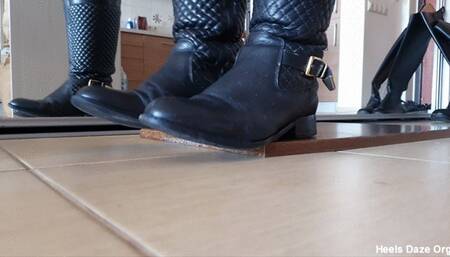Toe Tapping in Two Pairs of Leaher Boots