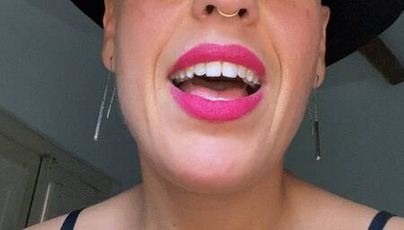 chewing a gum and making bubbles