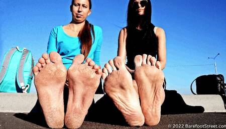 Anastasia and Kristina with huge feet barefoot on an asphalt field (Part 2 of 4) #20220420