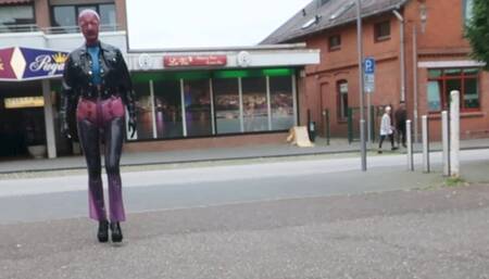 Pierced Latex Girl in Transparent Jeans, Stockings, Blouse,  Jacket, Demask  Corsett Mask  and Gloves walks in the town with piercings rings hanging out & Butt Plug Part III