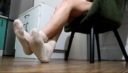 Foot rubbing in socks with a smell