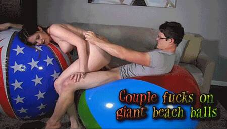Couple fucks on giant beach balls [720]