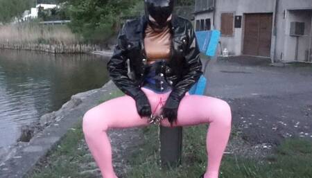 Pierced Latex Girl in Pink Leggings, Blouse,  Jacket, Demask  Corsett & Mask Gloves walks in the city with piercings rings hanging out & Masturbating Rubber Dildo PART III
