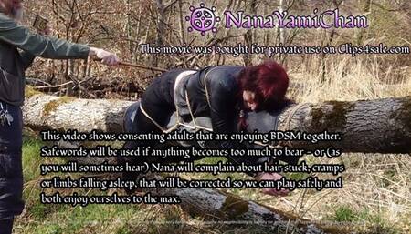 Girl tied to tree log in public forest, spanked to orgasm