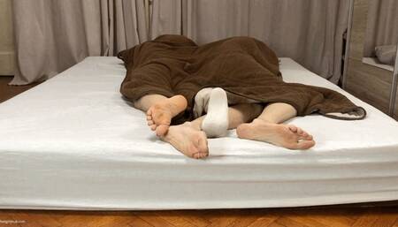 TWO GIRLS CUDDLING FEET UNDER BLANKET - MOV Mobile Version