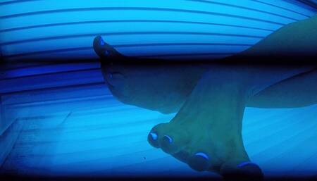 Peaking in on my tanning toes rolling around rotisserie  FOOT FETISH