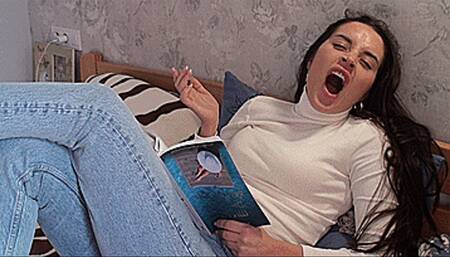 Yawns in front of a book!!! (1920x1080 Full HD) MOV