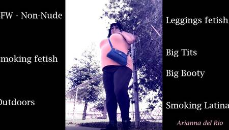 Latina Smoking Outdoors in Leggings