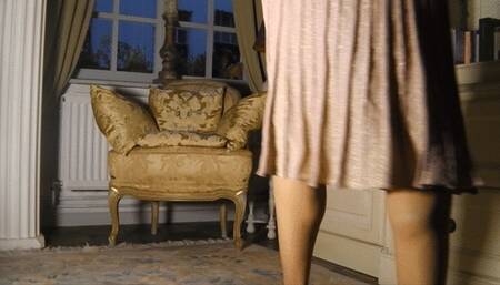 Reading in pink skirt