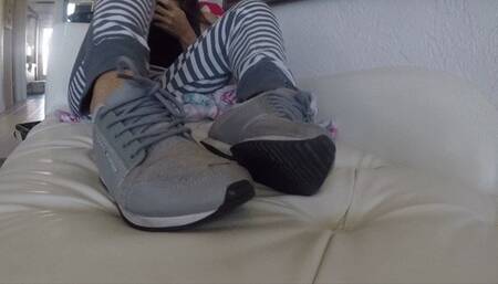 Home from the gym, relaxing on the sofa in sweaty sneakers and no socks SNEAKER FETISH