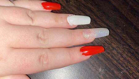 Long nails on a table and paper
