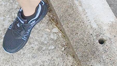 Tempest walking in blue sneakers