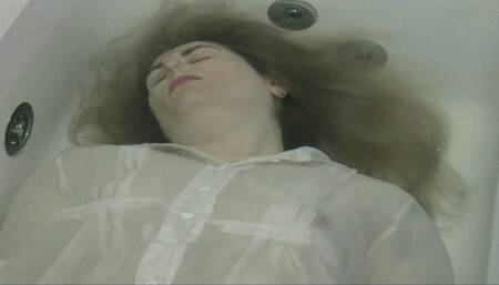 You are face up in bathtub where you try to go underwater and release a little air  MP4 HD 720p