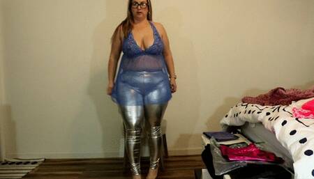 Daphne bends over in shiny leggings