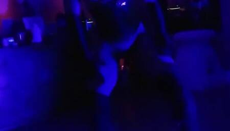 Lucy L'Vette dancing topless in a black patent leather waist cincher and boots