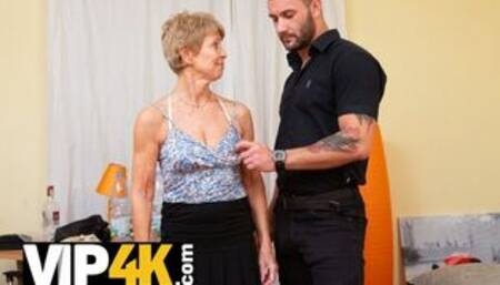 Tempting mature woman with dyed hair asks man for carnal fan