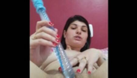 horny brunette sticking toy in pussy