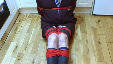 Man in adult school uniform bound and gagged on kitchen floor - cam one part 2