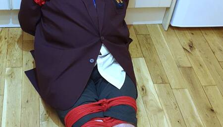 Man in adult school uniform bound and gagged on kitchen floor - cam one part 3