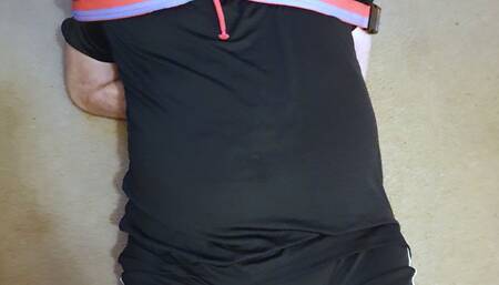 Footballer kicked in balls in black and red kit