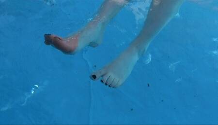 He films my feet and wrinkled soles while i'm chilling in a swimming pool