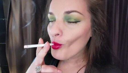 Bright red lips on an all white cigarette