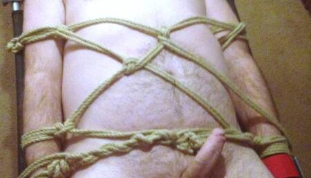Close up handjob on man tied to bed 2