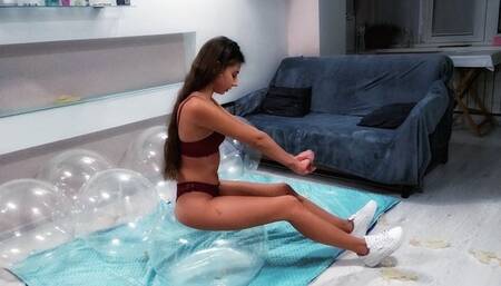 Sitting and popping many crystal balloons