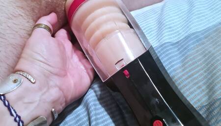 Using new male masturbator on a naked hogtied man