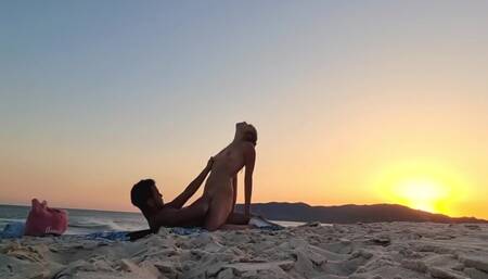 Romantic sex on the beach at sunset