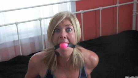 Homeinvaded housewife made to gag herself!