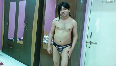 Sexy sissy crossdresser Sweet Lollipop kissing herself in the mirror in a thong only.