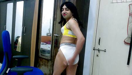 Dirty sissy crossdresser femboy Sweet Lollipop in a sports bra and thong.