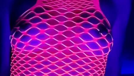 She's stripteasing in sexy dress under UV light