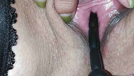 Close up peehole insertion with pissing