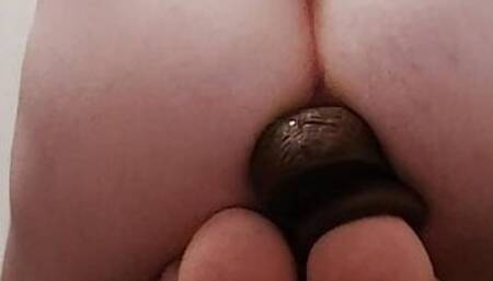 Deep strokes on a 12 inch black dildo