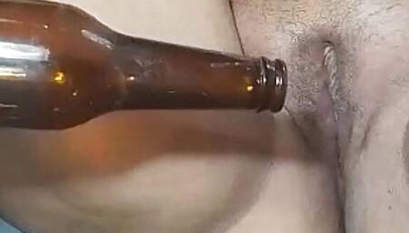 Colombian puts a bottle in her tight pussy.