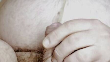 Chubby bear pisses in his moth and swallows