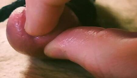 Close up oiled up cock and ball bondage