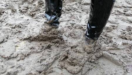 Boots, mud and miniskirt