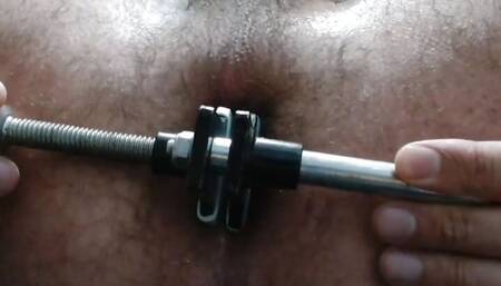 Enlarging the anus with a mechanic's tool
