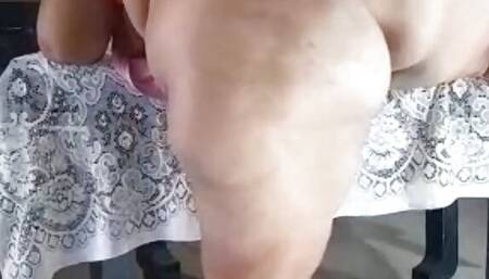 Moving her huge ass on the terrace of the house.