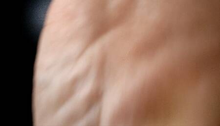 Wrinkled soles playing with the camera