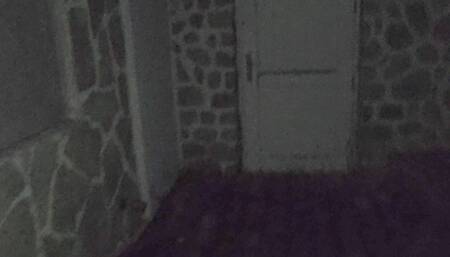Outdoor piss neighbours's door with spit