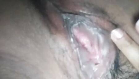 shows her small and hairy vagina open