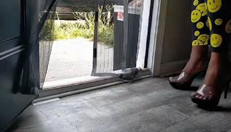 Two ebony goddess' tease foot bitch at the back door before leaving for a day out