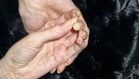 Long natural nails on dark tedy bear