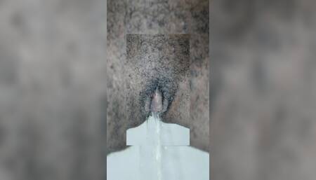 Pissing Big Clit With A Hairy Cunt